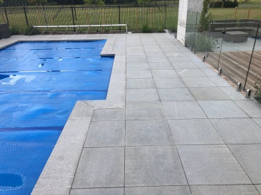 Grey Granite Dropface coping with matching paving