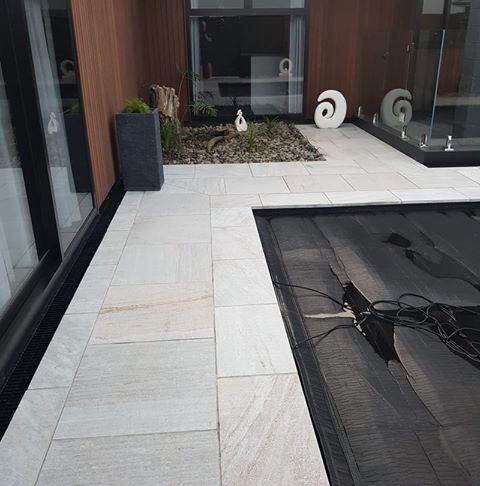 White Quartzite Square Edge with matching paving_wet